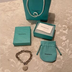 Tiffany & Co. Return to Tiffany sterling silver round tag charm bracelet.